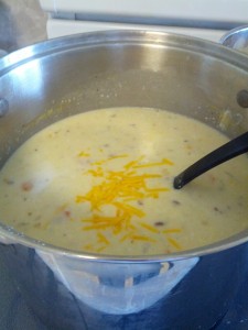 add the shredded cheese to the soup